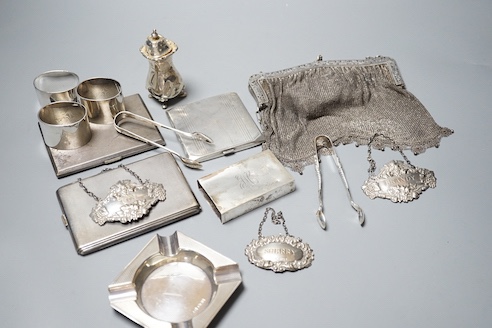 Sundry small silver including three silver cigarette cases, ashtray, three napkins rings, match sleeve, wine labels, pepper, gross and a white metal mesh evening bag.